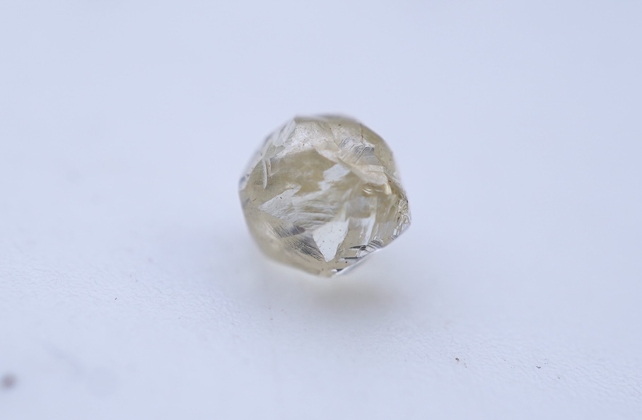 A rough diamond, with accompanying box and note, late 19th century